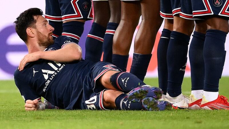 Lionel Messi lies behind the wall ahead of a free-kick during PSG’s win over Man City. Photograph: Franck Fife/Getty/AFP