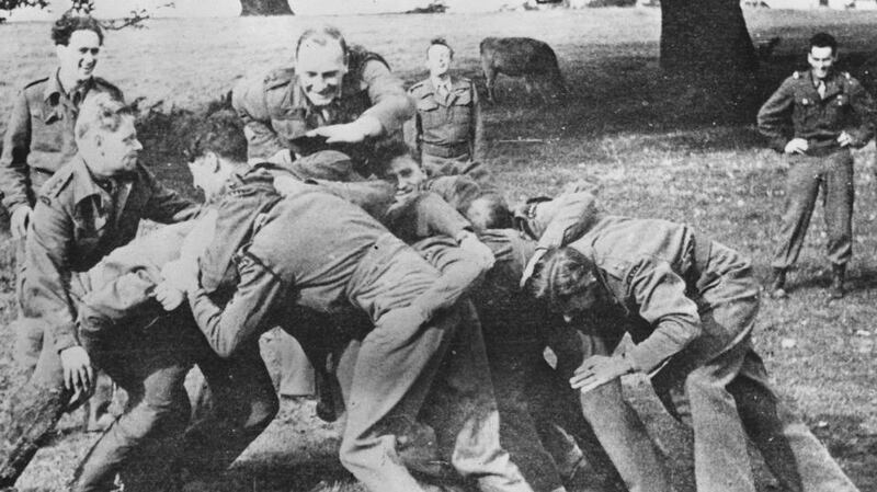 Mayne oversees an impromptu scrummaging session with SAS troops during the war. Photograph: Gavin Mortimer Private Collection