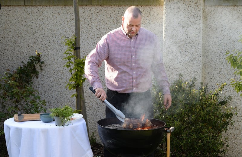 Gaz Smith cooking T-bone steak over a barbecue. Photograph: Dara Mac Dónaill/The Irish Times