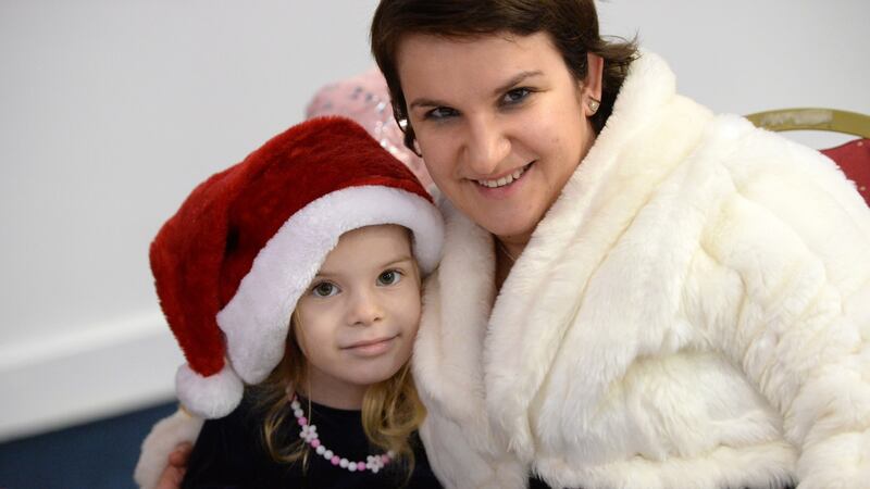 Lydia Pop with her daughter Evelyn Denisa Yudytha, (5) at the Knights of Columbanus Christmas dinner, at the RDS in Dublin on Christmas day. Photograph: Dara Mac Dónaill