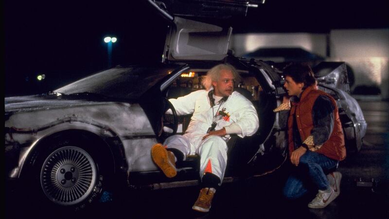 Christopher Lloyd and Michael J Fox with their DeLorean car time machine in Back to the Future