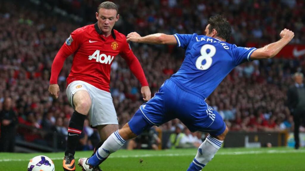 Chelsea target Wayne Rooney is challenged by Frank Lampard at Old Trafford. Photograph: Alex Livesey/Getty Images