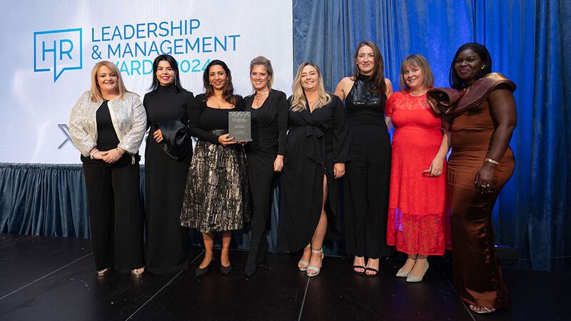 Maureen Walsh, managing director, DeCare, presents the best workplace diversity strategy award to the Three Ireland team