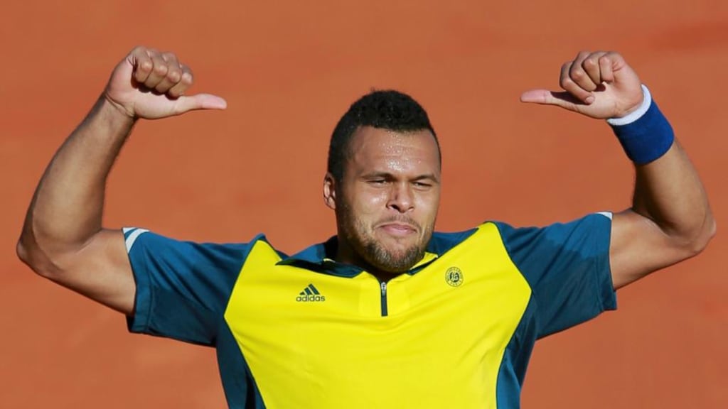 France’s Jo-Wilfried Tsonga celebrates defeating Roger Federer of Switzerland in their quarter-final at the Roland Garros stadium in Paris, yesterday. Photograph: Inpho