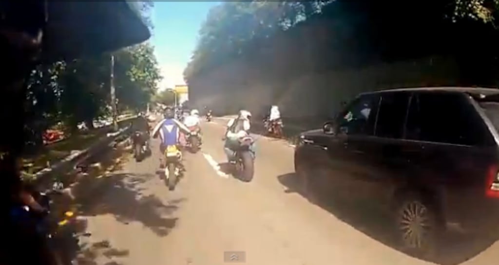 A still taken from video shows a biker slowing in front of an SUV on the Henry Hudson Parkway in New York ahead of a series of collisions. Photograph: Youtube