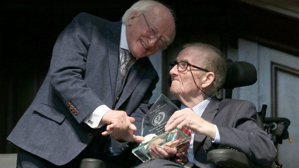President Michael D Higgins presents an award to the SDLP’s Ivan Cooper at the Guildhall in Derry. Brian Lawless/PA Wire