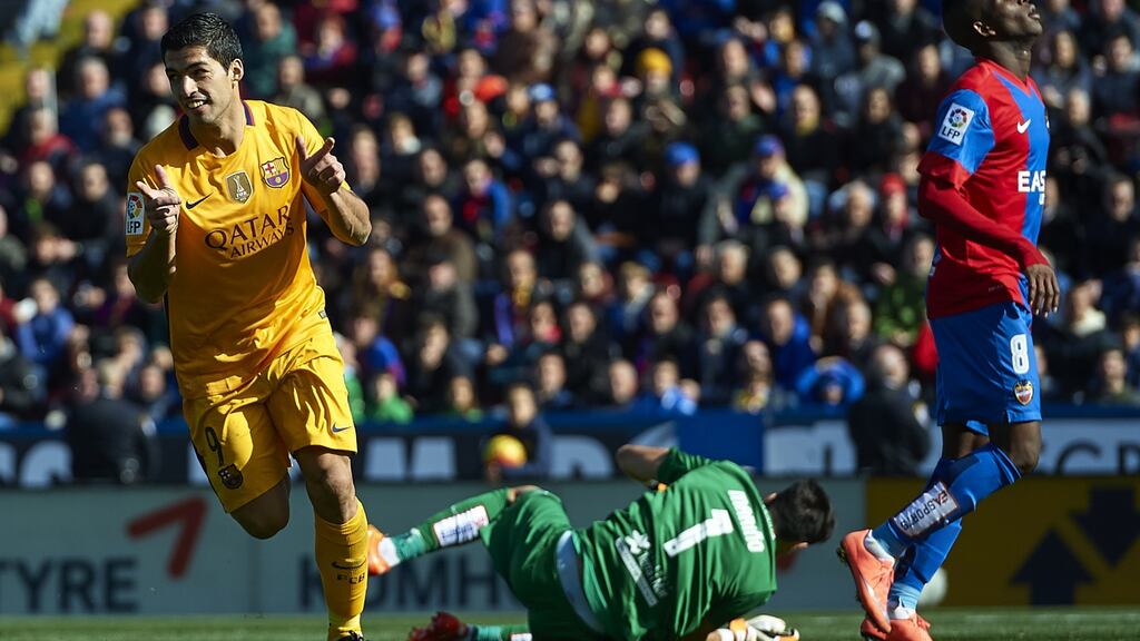 Barcelona’s Luis Suarez celebrates scoring his team’s second goal during the La Liga match against Levante at Ciutat de Valencia. Photograph: Manuel Queimadelos Alonso/Getty Images