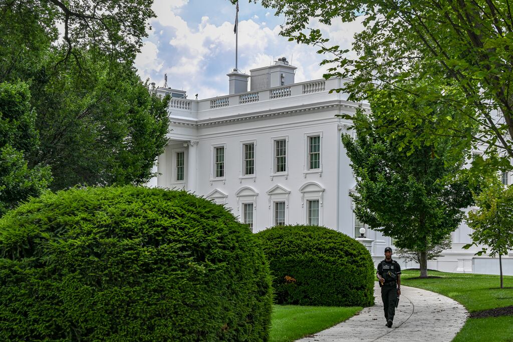 A Secret Service Agent walks along the north front of the White House in Washington on Wednesday. Photograph: Kenny Holston/New York Times