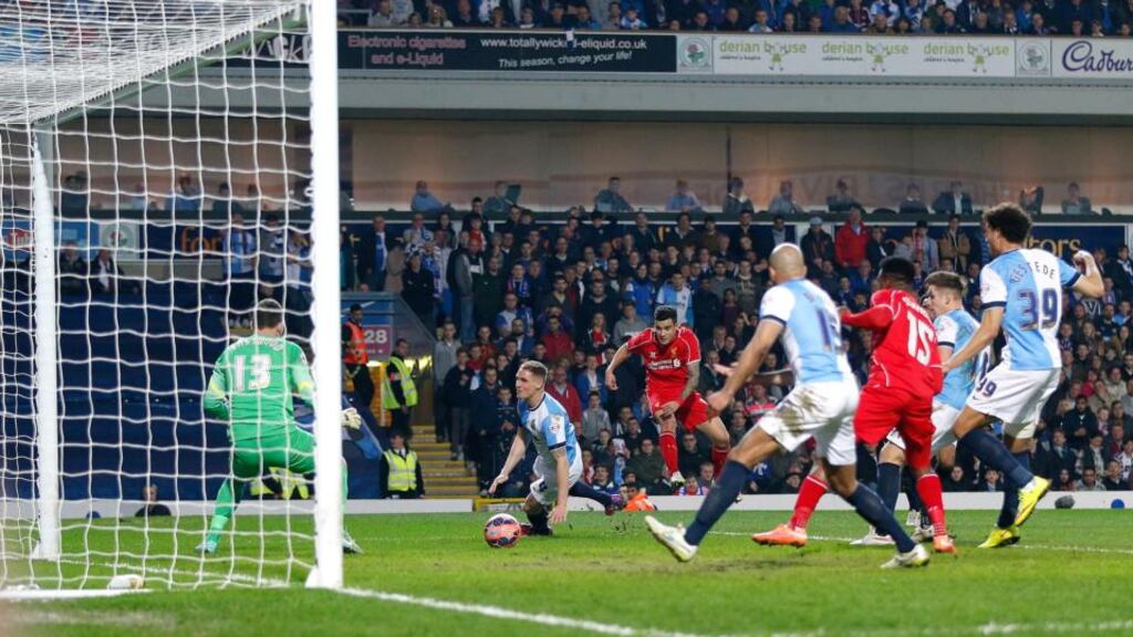 Liverpool’s Philippe Coutinho scores the winning goal during the FA Cup quarter-final replay against Blackburn Rovers at Ewood Park. Photograph: Lynne Cameron/PA