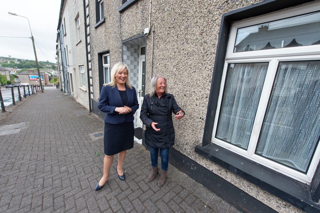 Michelle O'Neill, MLA and designated First Minister in the Assembly meets neighbour Nancy Lavery as she visits her old family home on Oliver Plunkett Hill, in Fermoy, Co Cork. Photograph: Michael Mac Sweeney/Provision