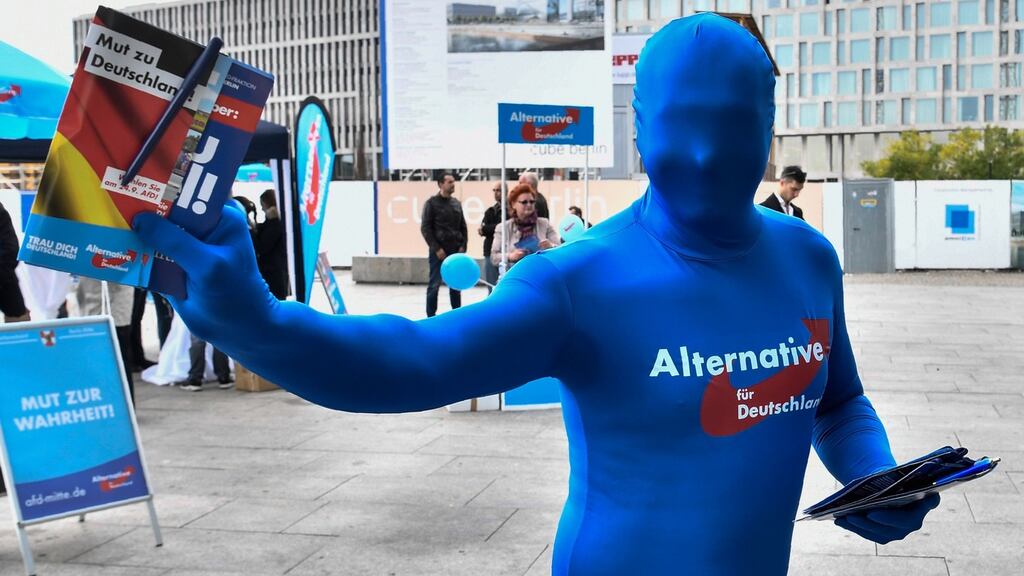An activist distributes flyers for the far-right AfD party in Berlin.  It has been reported that Germany’s domestic intelligence agency may place the AfD  under full surveillance, sparking shockwaves in an election year. File photograph: John MacDougall/AFP/Getty Images