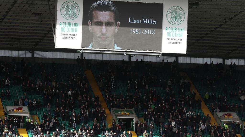 Celtic fans stand for a minute’s silence in memory of Liam Miller at Parkhead. Photograph: Andrew Milligan/PA