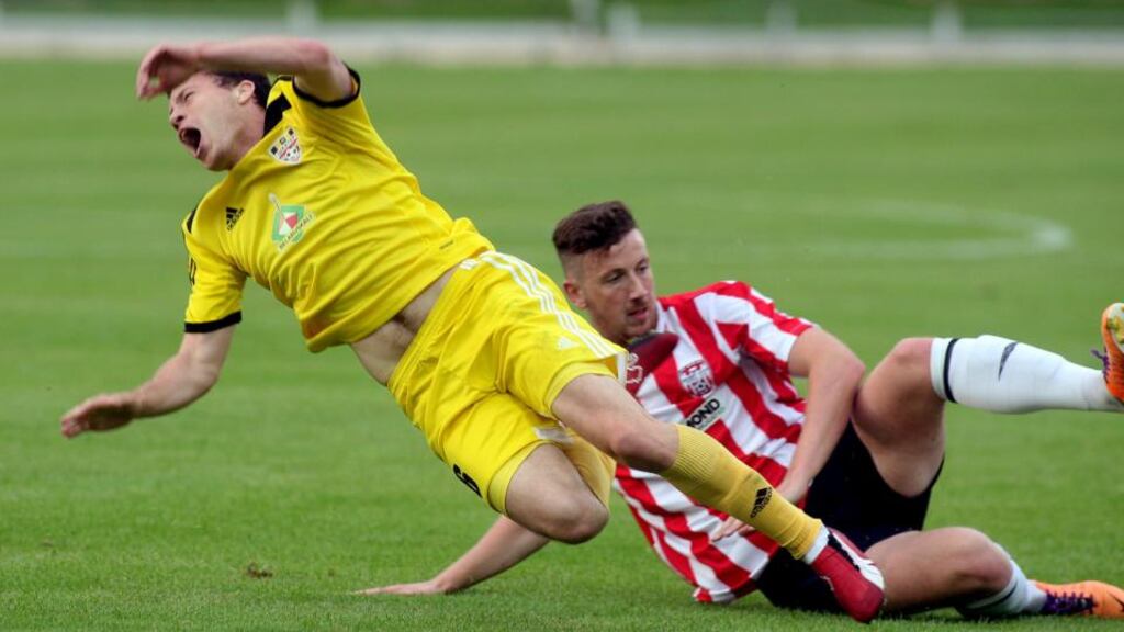 Shakhtyor Saligorsk’s Siarhei Balanovich (left) is tackled by Shane McEleney of Derry during last night’s Europa League Second Qualifying Round first leg tie at the Brandywell. Photograph: Lorcan Doherty/Inpho/Presseye