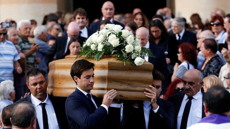Journalist Daphne Caruana Galizia’s sons Matthew and Paul carry her coffin outside the Rotunda parish church in Mosta, Malta, on November 3rd, 2017. Photograph: Alessandro Bianchi/Reuters