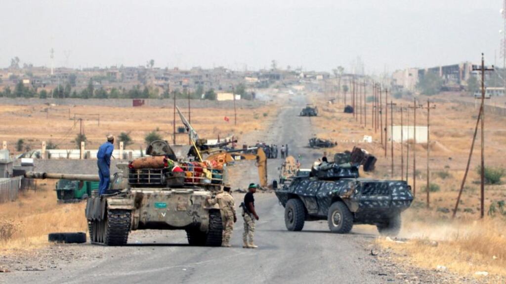Iraqi forces advance during clashes with fighters from Islamic State near Baiji, northern Iraq on Friday. Photograph: EPA