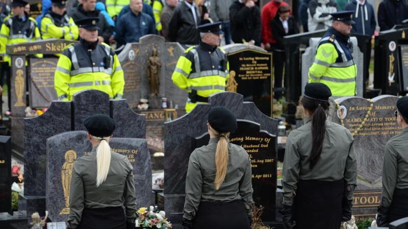 Gardai watch the crowd during the first Alan Ryan anniversary commemoration march at Balgriffin Cemetery in north Dublin last Saturday. Photographer: Dara Mac Dónaill/The Irish Times