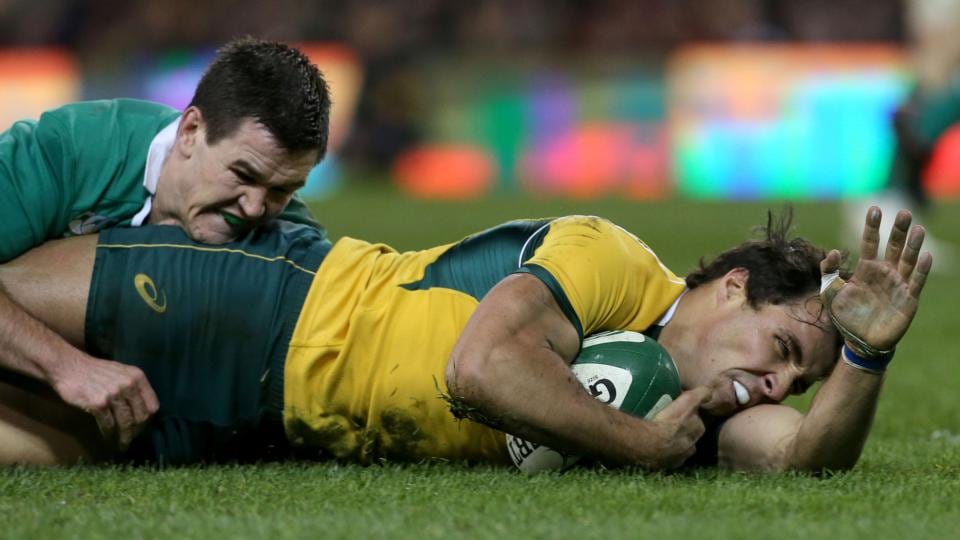 Australia’s Nick Phipps scores his second try under pressure from Jonathan Sexton. Photograph: Ryan Byrne / Inpho