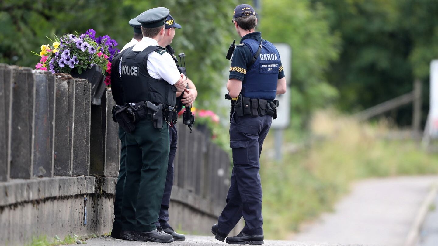 PSNI officers and gardaí stand exactly on the Border in Belleek, Co Fermanagh, ahead of then UK prime minster Theresa May’s visit to Belleek pottery factory on the northern side. Photograph: Niall Carson/PA