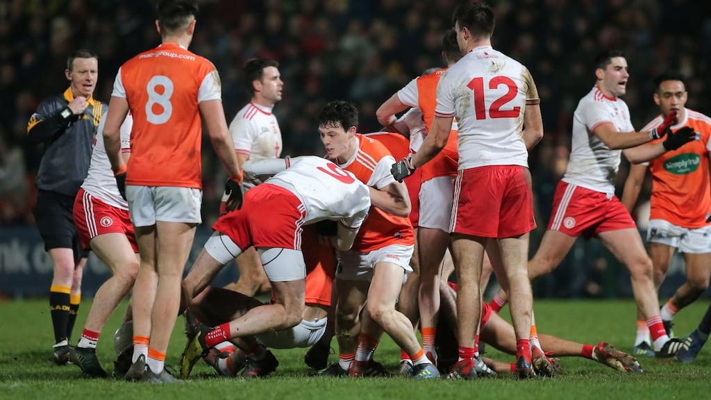 Tyrone and Armagh players during the McKenna Cup final at the Athletic Grounds. Photograph: Philip McGowan/Inpho