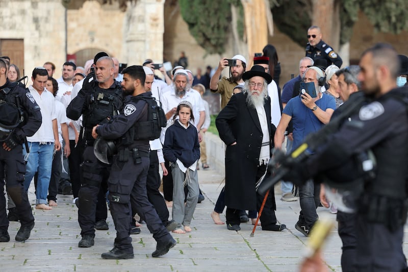 Jewish visitors, protected by Israeli security forces, at the Al-Aqsa mosque compound, also known as the Temple Mount complex to Jews, in Jerusalem on Sunday. Photograph: Ahmad Gharabli/AFP/Getty