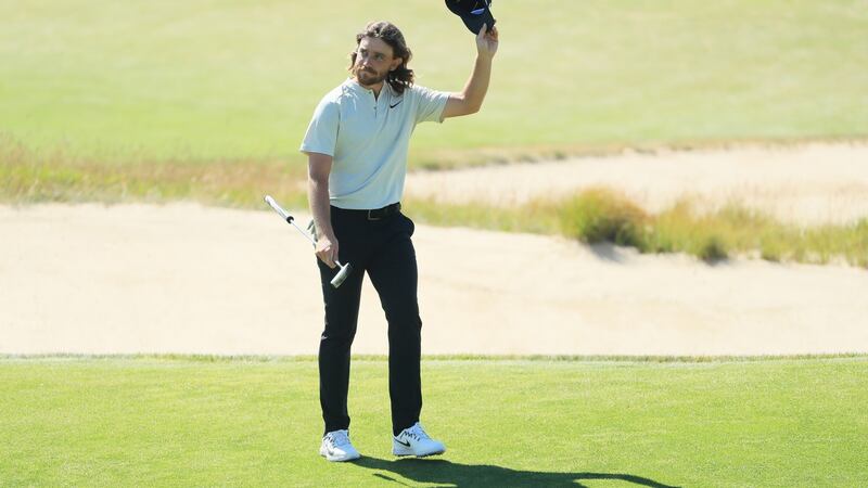 Tommy Fleetwood acknowledges the crowd on the 18th green. Photo: Andrew Redington/Getty Images