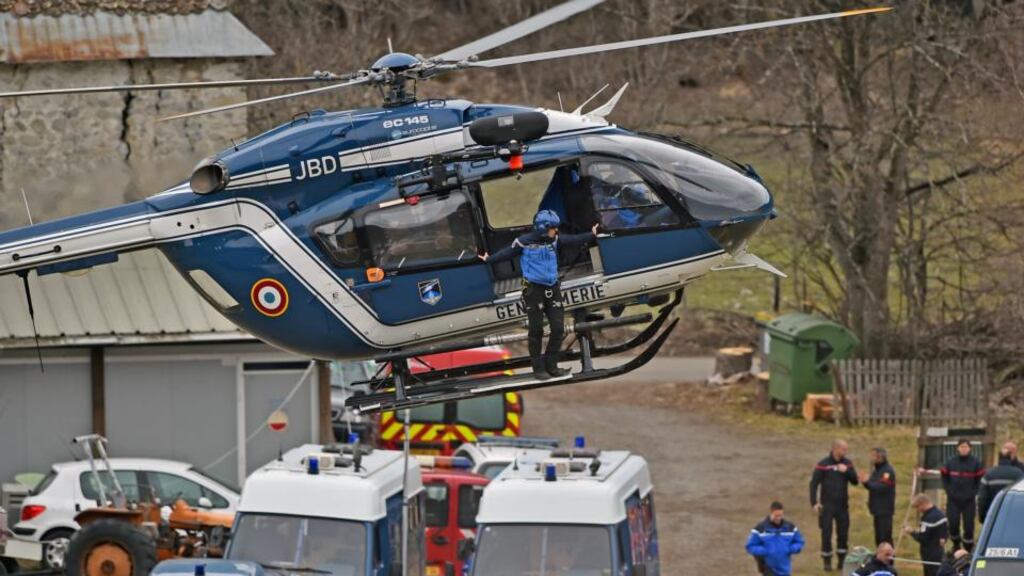 Rescue workers and gendarmerie arrive by helicopter as they continue their search operation near the site of the Germanwings plane crash in the French Alps. Photograph:Jeff J Mitchell/Getty Images