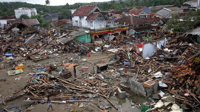 This general view shows survivors salvaging items from the debris around destroyed or damaged homes in Sumur on Java island on December 24th, 2018. Photograph: Demy Sanjaya /AFP/Getty Images
