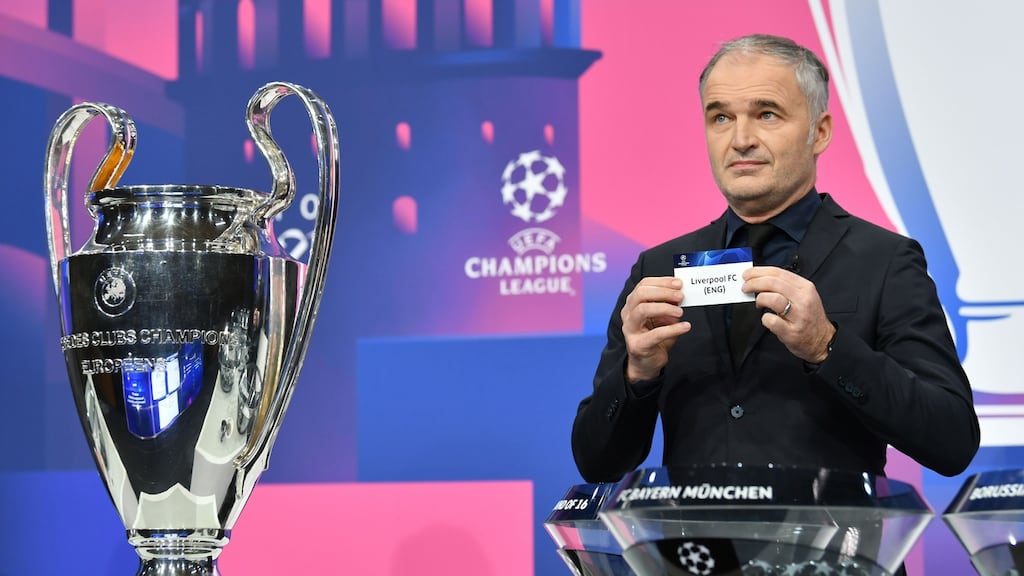 Former Swiss star Stephane Chapuisat reveals the slip of Liverpool FC during the draw for the round of 16 of the Champions League at Uefa headquarters in Nyon. Photograph: Harold Cunninham/AFP/Getty Images