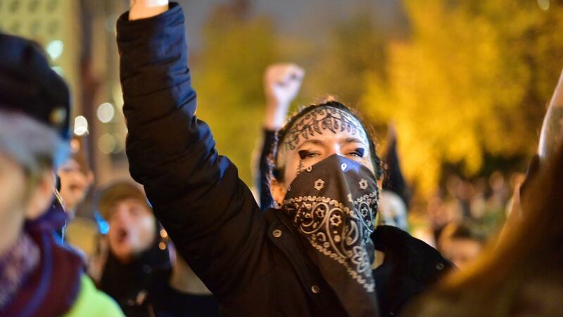 People gather at Portland City Hall to protest of the election of president-elect, Donald Trump on Friday in Portland, Oregon. Photograph: Mark Graves/The Oregonian via AP