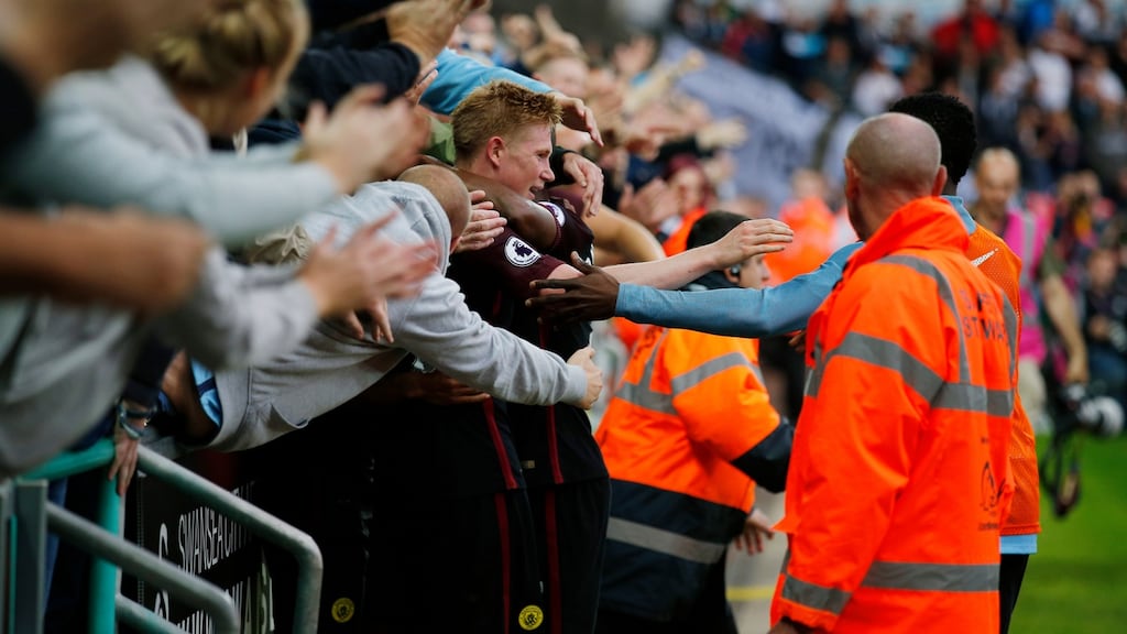 Manchester City’s Raheem Sterling celebrates scoring his team’s third goal in the away end. Photograph: Andrew Couldridge/Reuters