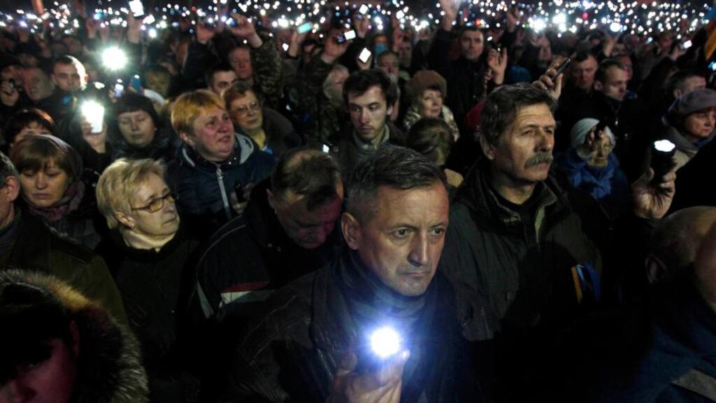 Anti-government protesters use torches and mobile devices during a rally in central Independence Square in Kiev on February 21st, 2014. Photograph: David Mdzinarishvili/Reuters