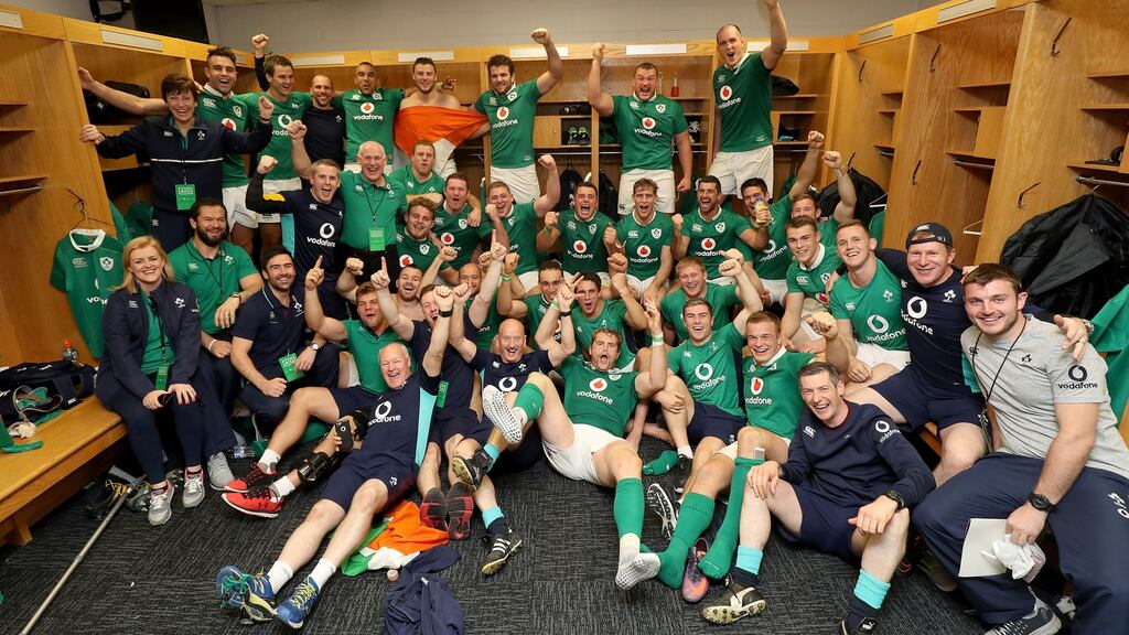 The Ireland team and management celebrate in the dressing-room of Soldier Field. Photograph: Dan Sheridan/Inpho