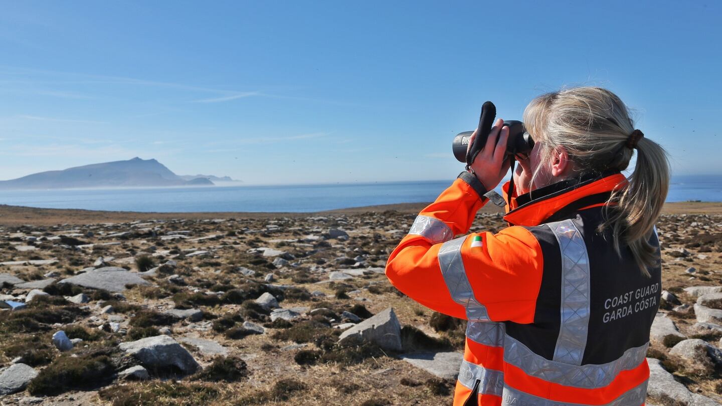 A member of the Irish Coast Guard surveys the north Mayo coastline. Photograph: Colin Keegan/Collins.