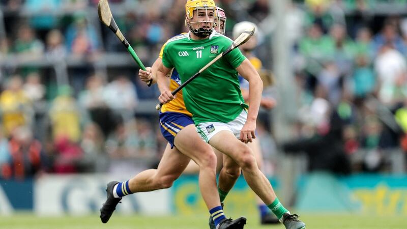 Limerick’s Cathal O’Neill is challenged by Clare’s Tony Butler. Photograph: Laszlo Geczo/Inpho