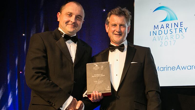 Jim O'Byrne, General Manager, SEFtec NMCI Offshore & GAC Maritime Training, presents the Excellence in Marine Safety Award to Nicholas Bendon, SAMS Solutions - CH Marine.
