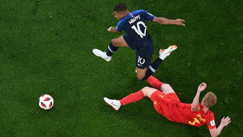 Kylian Mbappé gets beyond Belgium’s Kevin De Bruyne in the World Cup semi-final. Photograph: Jewel Samad/AFP/Getty Images