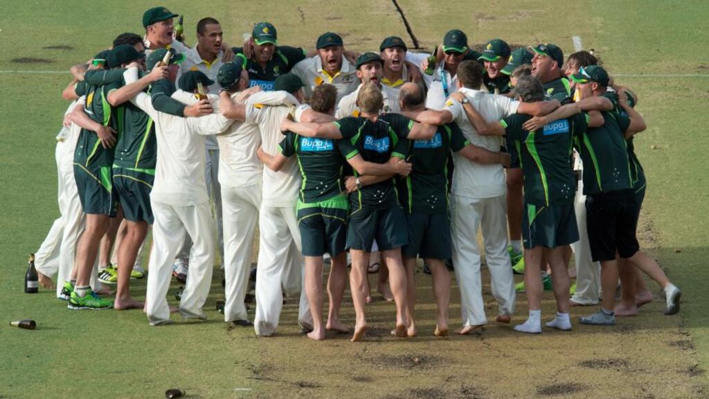 Australian cricketers celebrate their Ashes win on the pitch several hours after play on day five of the 3rd Test match against England at the WACA in Perth. Photograph: Dave Hunt/EPA
