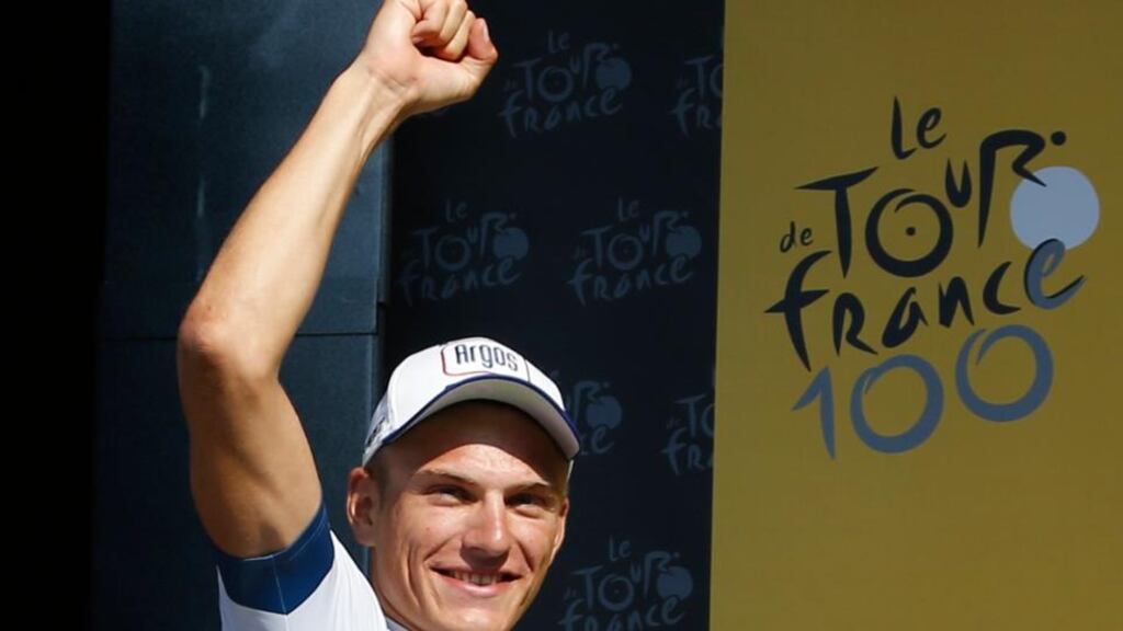Argos-Shimano team rider Marcel Kittel of Germany celebrates on the podium after he won the 197 km tenth stage of the centenary Tour de France. Eric Gaillard/Reuters