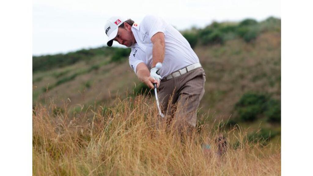 Graeme McDowell plays his second shot out of the rough at the second hole during the second round of the Scottish Open at Castle Stuart today. Photograph: David Moir/Reuters