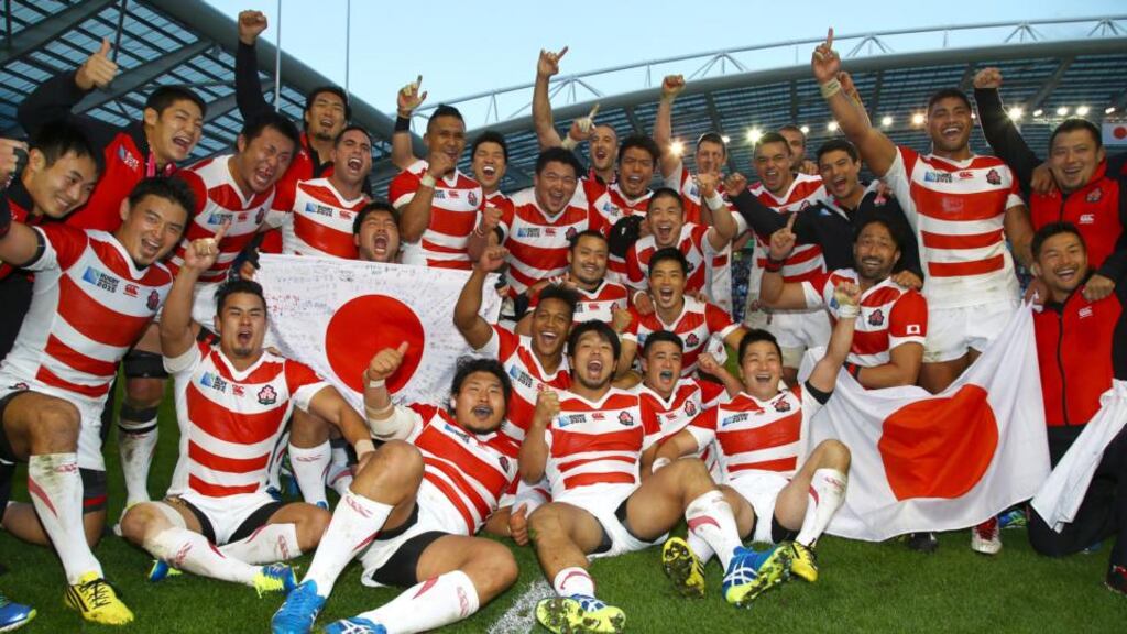 Japan players celebrate after beating South Africa in the World Cup Pool B game at Brighton Community Centre on Saturday. Photograph: by Steve Haag/Gallo Images.