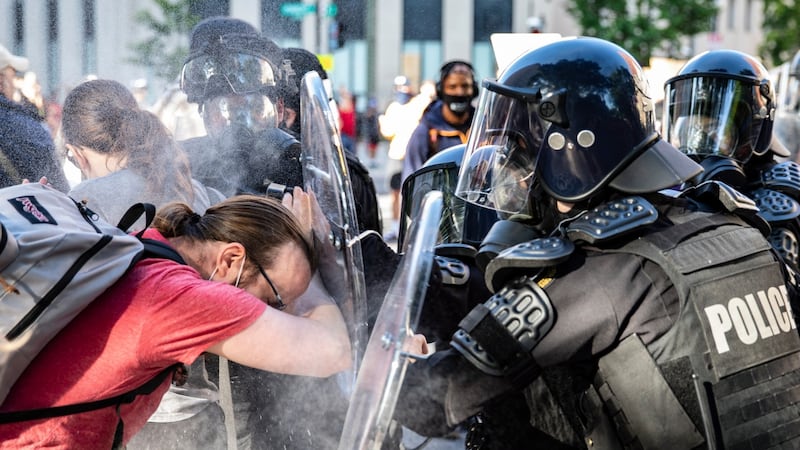 Officers pepper spray a protester while pushing him back during a demonstration over the death of George Floyd, who died in police custody, near the White House on June 1st 2020. Photograph: Samuel Corum/EPA