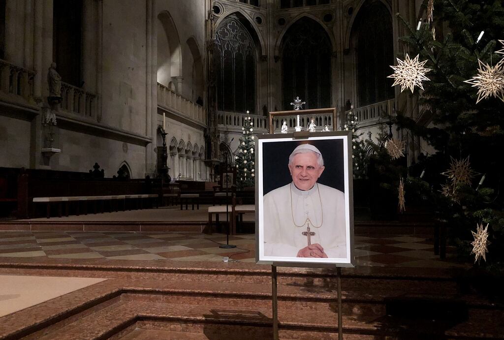 A portrait of Pope Emeritus Benedict XVI is seen near the altar at the Cathedral of Regensburg, southern Germany. The death of the former Pope was announced by the Vatican on Saturday. Photograph: Florian Cazeres/AFP via Getty Images