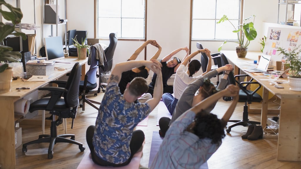Yoga has recently been introduced in offices as a way to improve the well-being of workers. Photograph: Getty Images