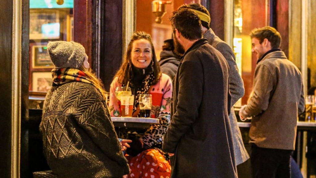 Socialising in Temple Bar following the easing of Covid-19 restrictions: The Taoiseach pulled a rabbit from a hat, and in a puff of smoke, the pandemic was gone. In reality, that’s not exactly the case. Photograph: Damien Storan/PA