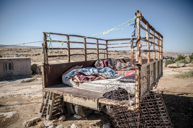 The truck where Imran Nawaja’a's wife sleeps at night to protect their animals from settlers. Photograph: Sally Hayden