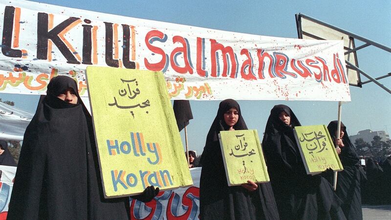 Iranian women hold banners reading ‘Holy Koran’ and ‘Kill Salman Rushdie’ during a demonstration against the author of The Satanic Verses in Tehran on February 17th, 1989. Photograph: Norbert Schiller/AFP/Getty