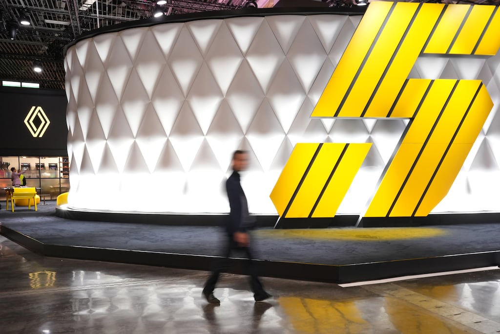 A sign the Renault 5 E-Tech electric automobile at the Renault pavilion at the Paris Motor Show in Paris. European carmakers are planning dozens of affordable electric models next year as they brace for an “EV winter” driven by tough new EU carbon emission targets and fierce competition from China. Photograph: Nathan Laine/Bloomberg