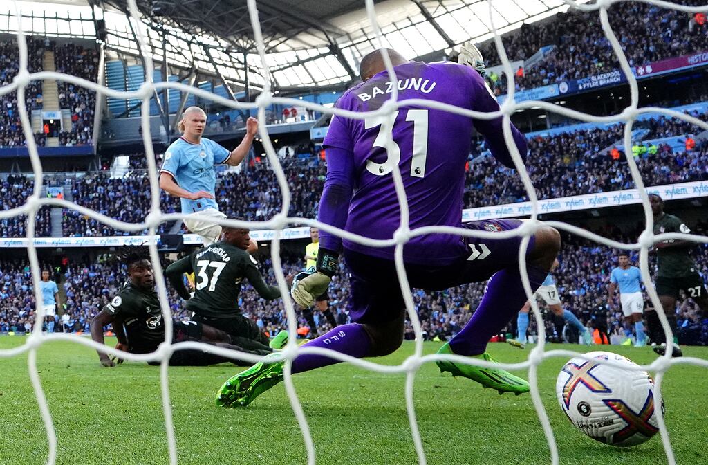 Erling Haaland scores Manchester City's fourth goal past Southampton goalkeeper Gavin Bazunu during the Premier League match at the Etihad Stadium. Photograph: Martin Rickett/PA Wire