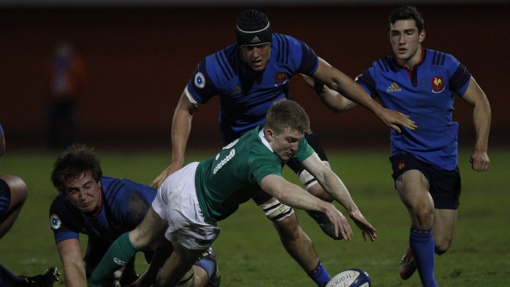 Ireland’s scrum-half Stephen Kerins under pressure during his side’s defeat to France. Photograph: AFP
