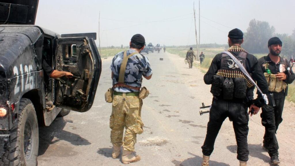 Iraqi security forces and armed volunteers move with military vehicles during clashes with militants of Islamic State in Iraq and Syria (Isis), also known as the Islamic State in Iraq and the Levant, in the town of Dalli Abbas in Diyala province. Photograph: Reuters.